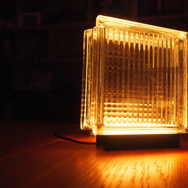 Amber glow casting light across a wooden surface