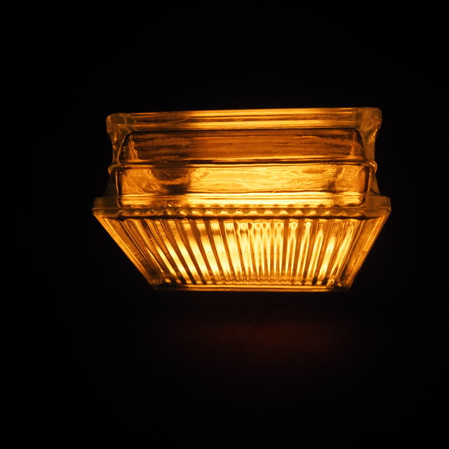 The top of the glass block glowing amber